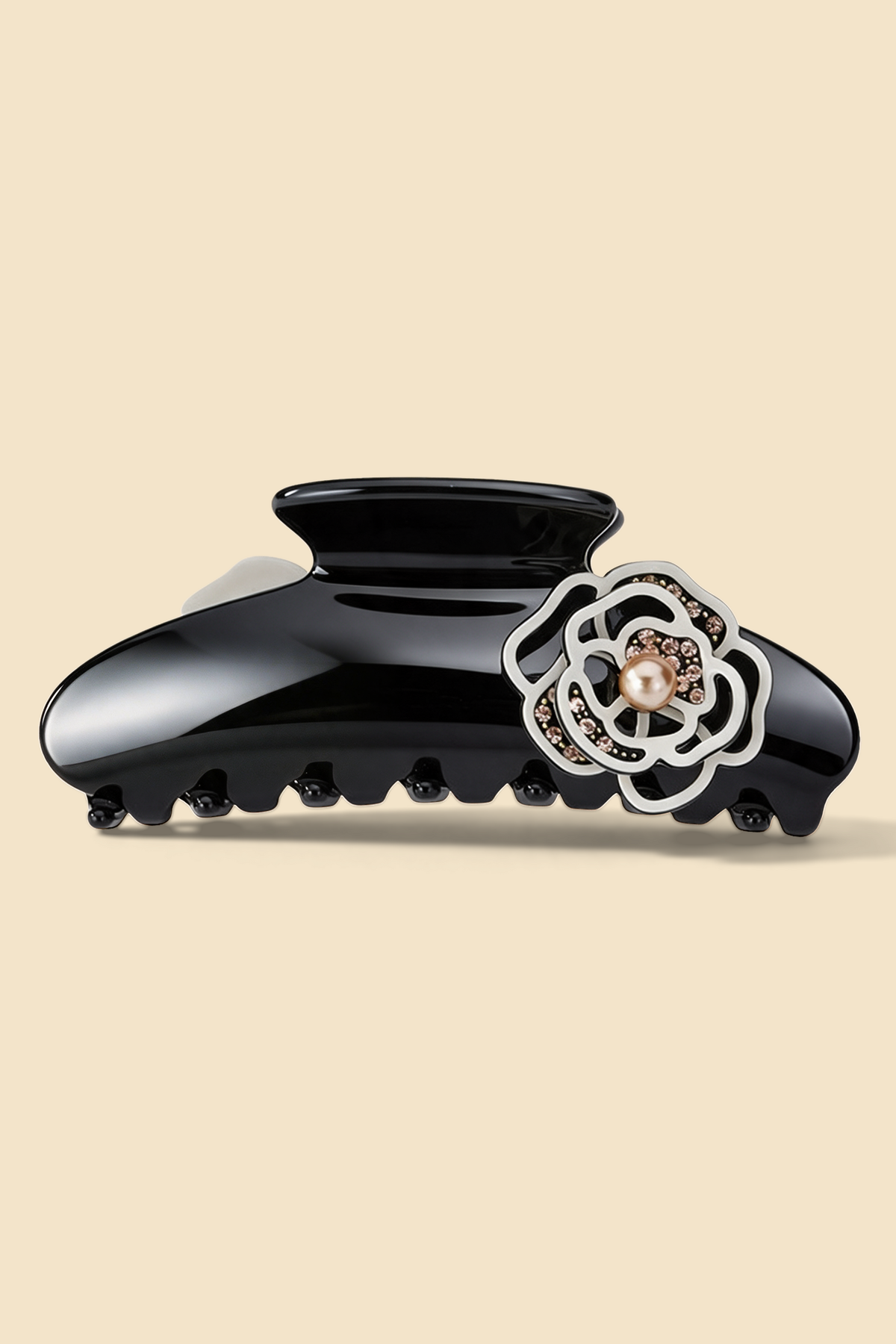 Camellia Claw Clip in Beige, with a glossy black body and beige camellia ornament.