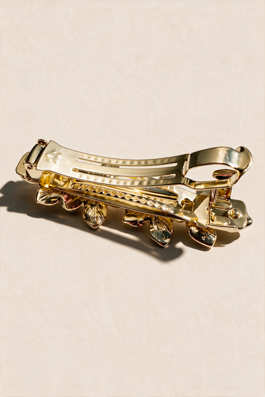 Back of the Ivory Blossom Barrette showing its gold-tone clasp.