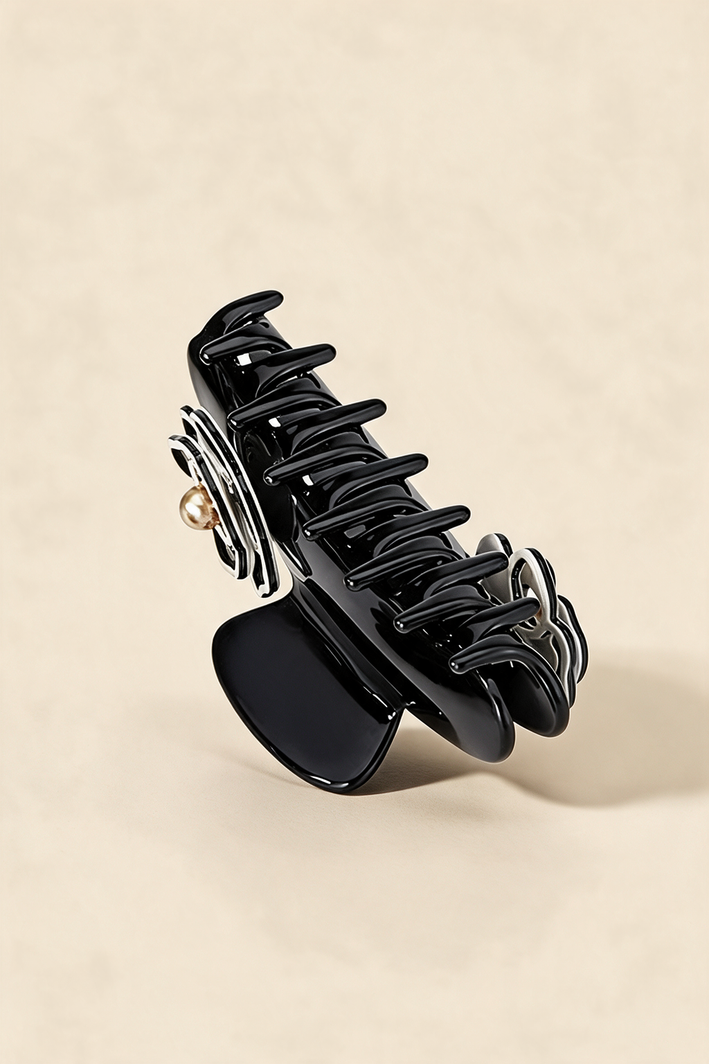 Rear view of the Camellia Claw Clip showing the spring and interlocking teeth.