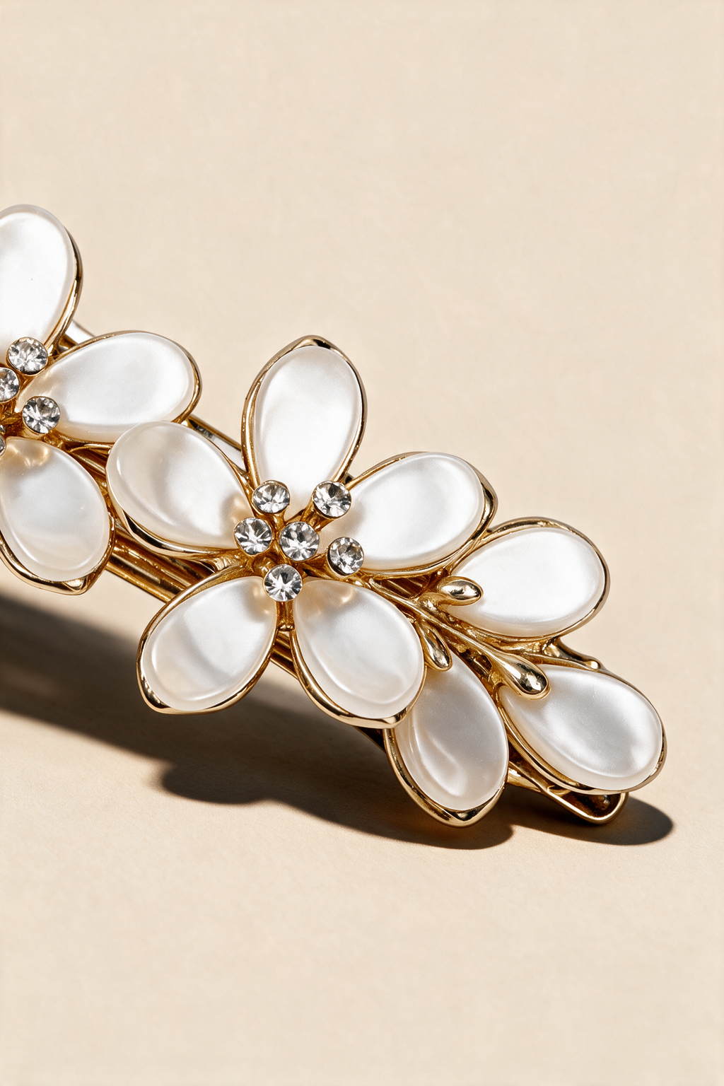 Close-up of Ivory Blossom Barrette's pearlescent petals and sparkling flower centres.